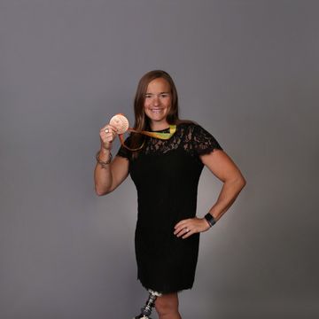 Melissa Stockwell, U.S. Army veteran and Paralympic medalist, holding a medal